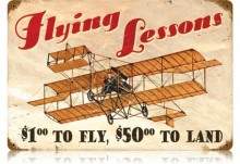 Retro flying lessons tin sign
